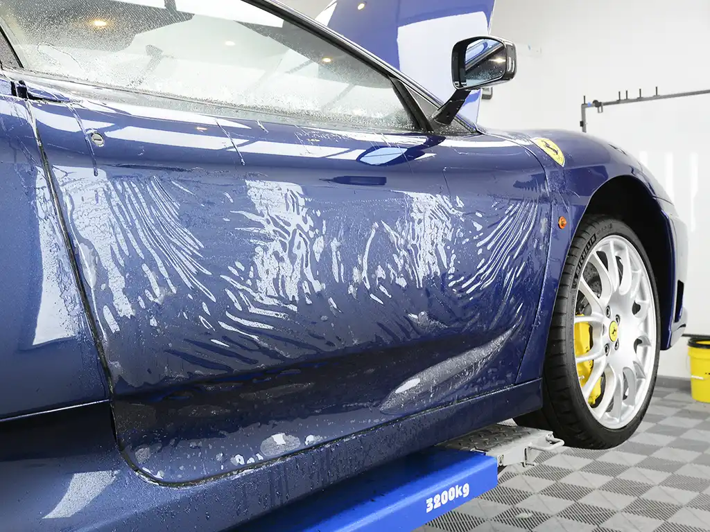 PPF being installed on Ferrari 360CS door